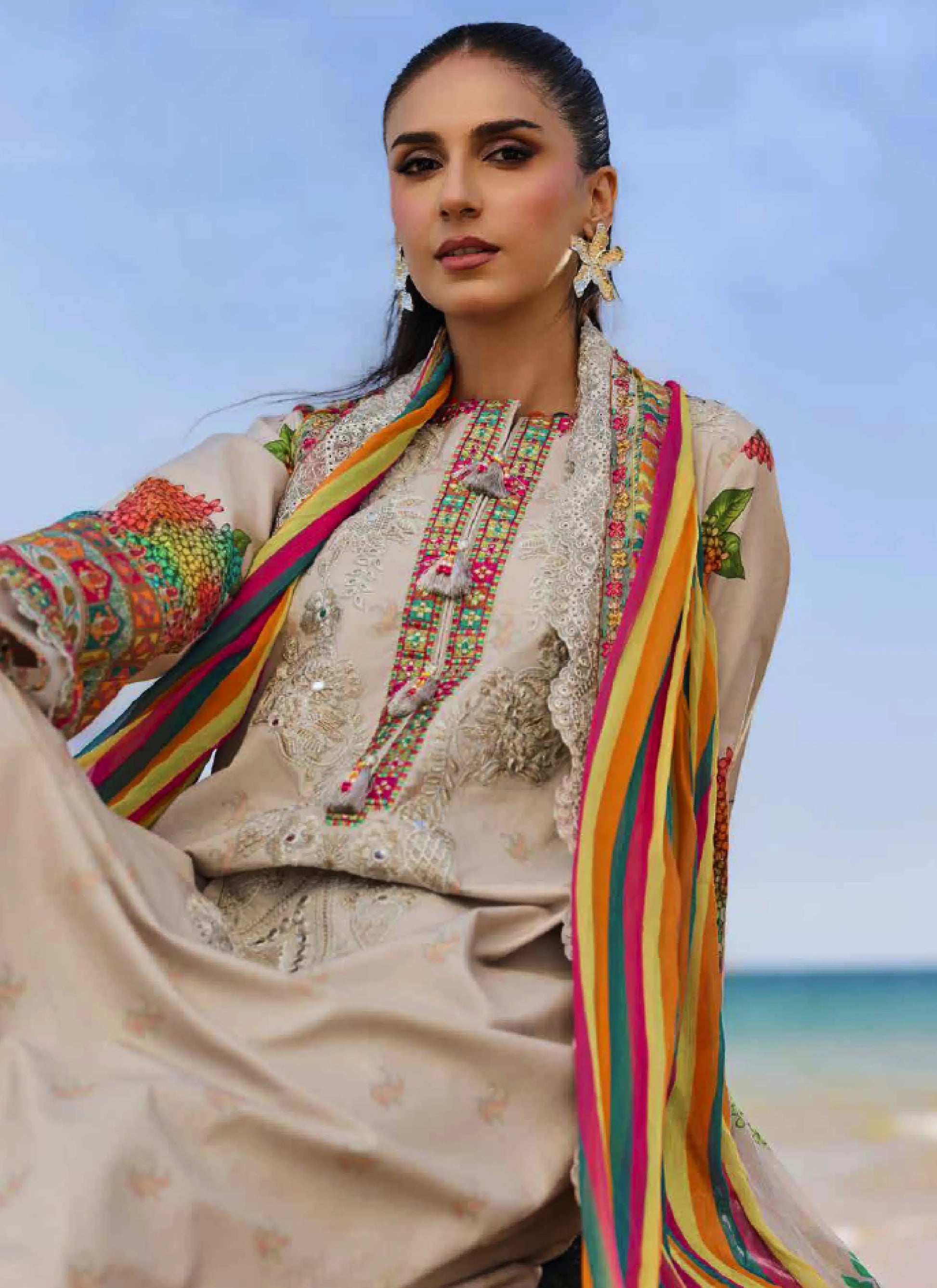 Close-up front view highlighting the detailed multicolored embroidery on the neckline, printed sleeve borders, and magenta front daman patti.