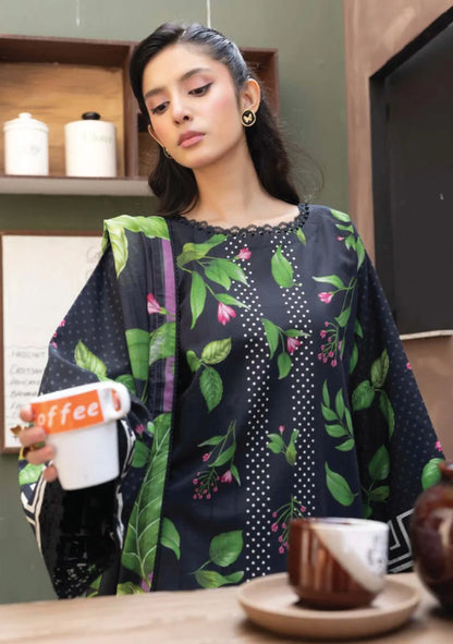 Close-up front view focusing on the fine black lace neckline trim and green leaf print configuration on the shirt bodice.