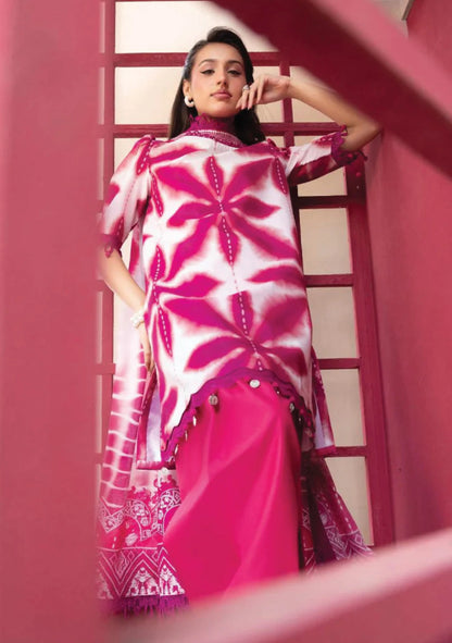 Low angle model portrait highlighting the vivid magenta pink geometric starburst layout on the shirt bodice code MB-ELHV4-04.