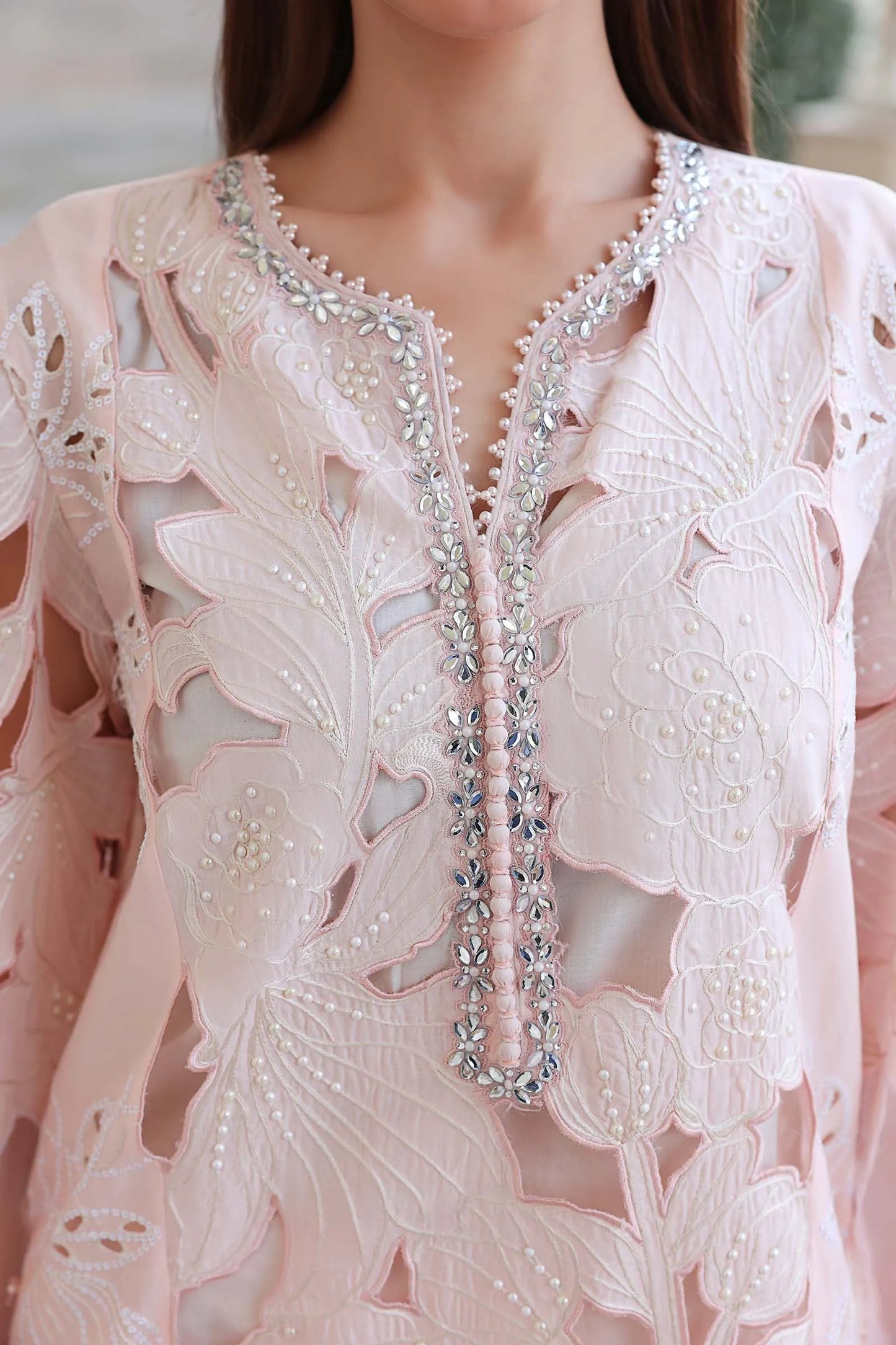 Extreme close-up front view highlighting the premium organza neck lace adorned with stick-on diamantes and pearl details code D2.