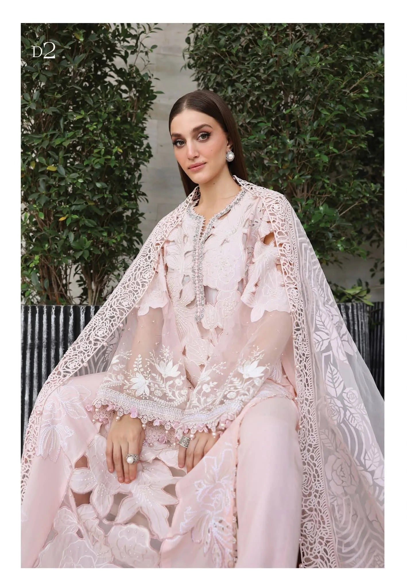 Sitting model look showcasing the luxury translucent look of the dyed burnout organza dupatta and floral shirt cutouts code D2.