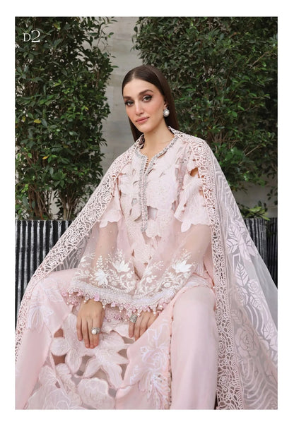 Sitting model look showcasing the luxury translucent look of the dyed burnout organza dupatta and floral shirt cutouts code D2.