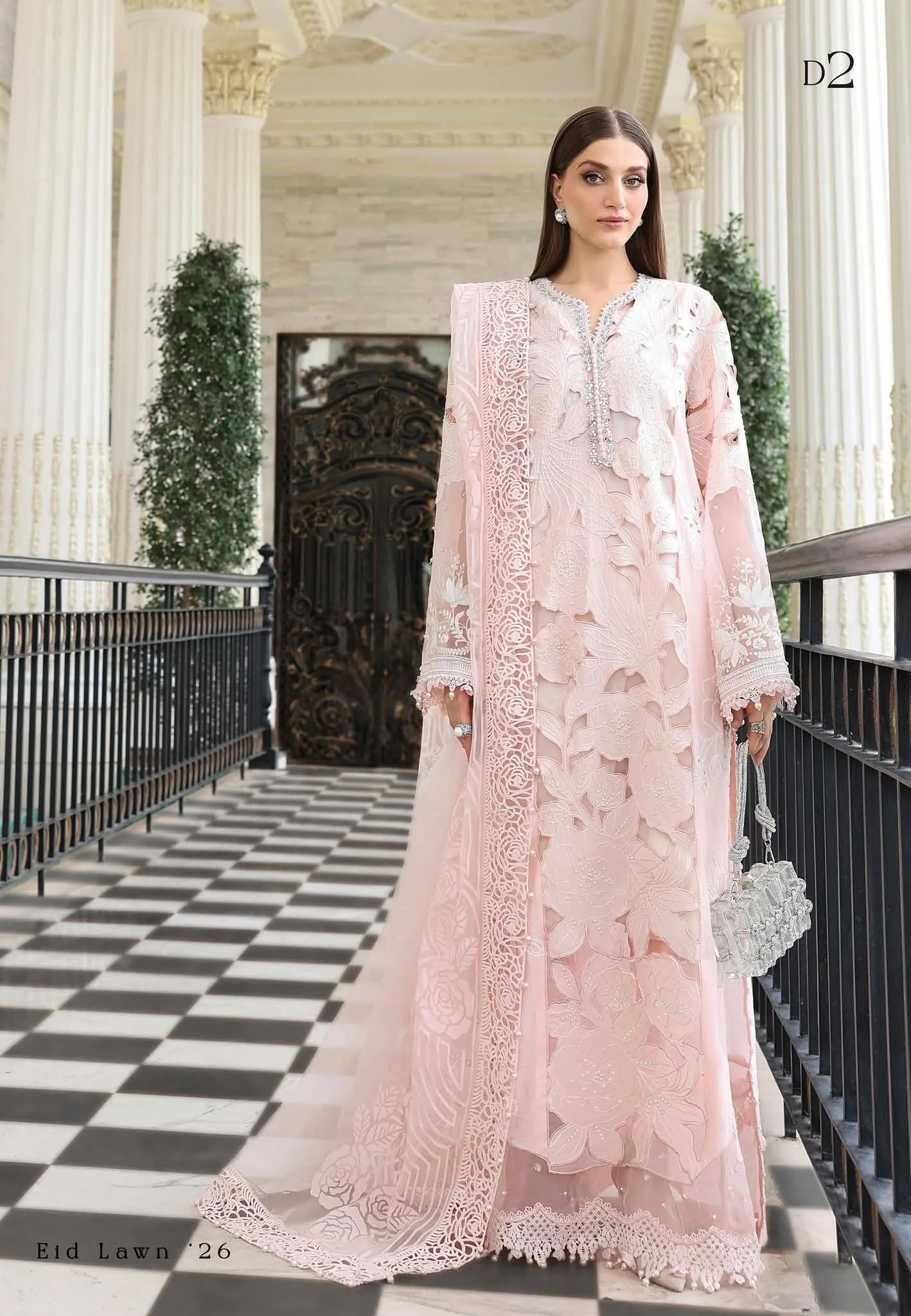 Full-length front studio look of Maria B Luxury Lawn Eid Edit 2026 design code D2 blush pink embroidered suit with burnout organza dupatta.