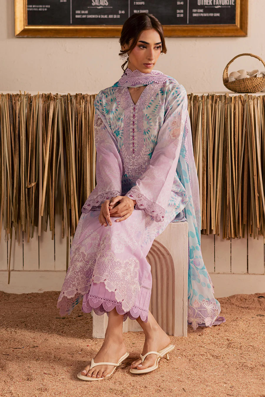 Side profile styled look of premium traditional designer lavender lawn ensemble NSG222.