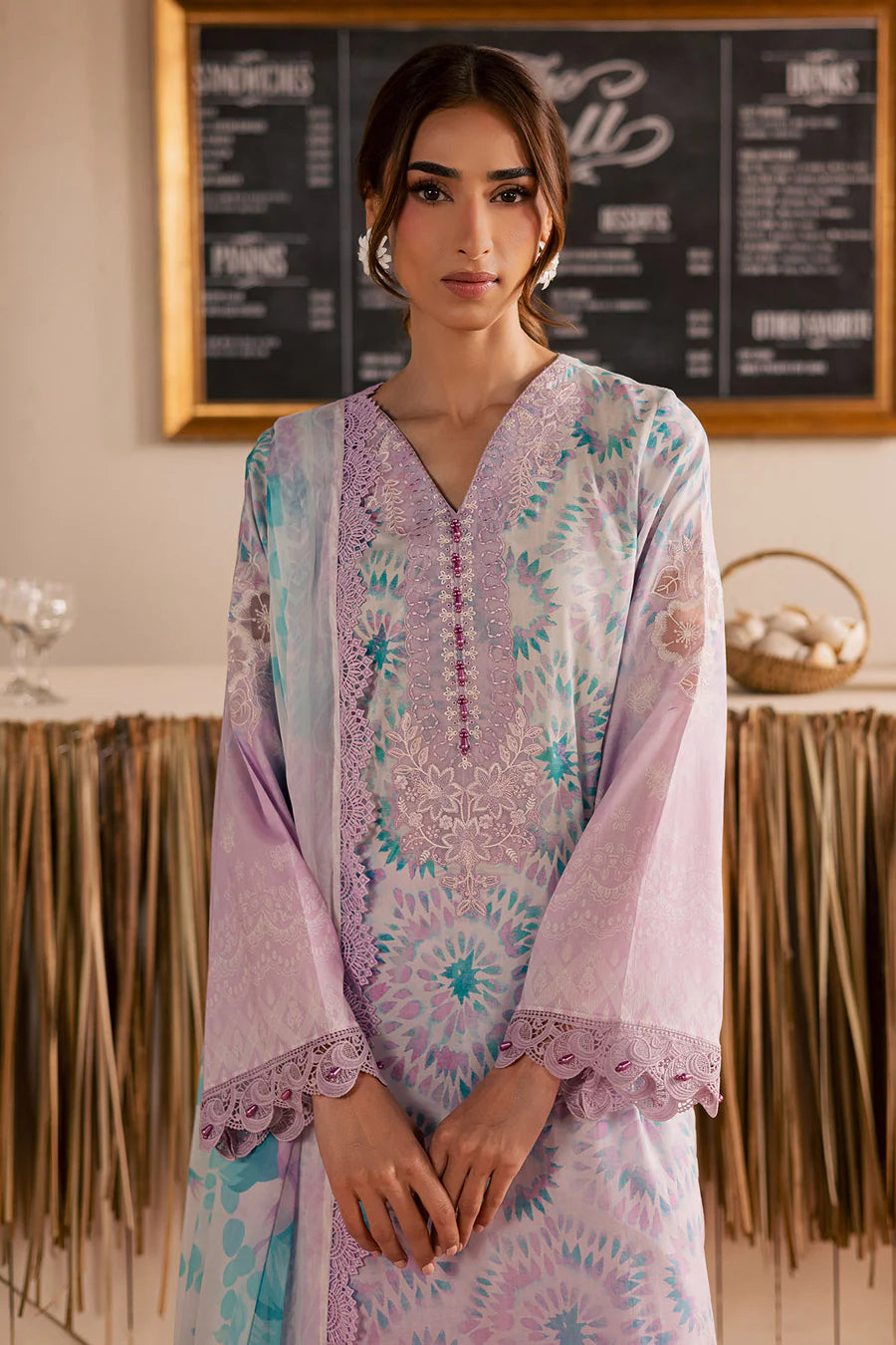 Close-up view of the detailed embroidered patch lace attached to the sleeves on design NSG222.