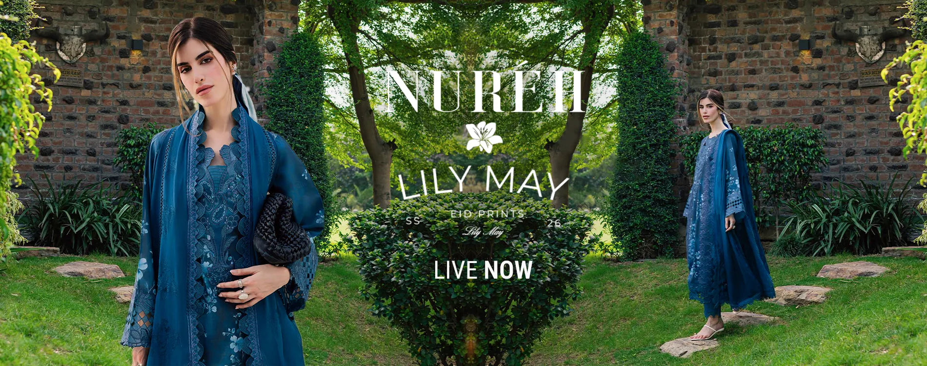Wide homepage slider banner announcing the launch of the Nureh Lily May Eid Prints 2026 collection, featuring front and full-length views of a model in a garden wearing a luxury deep teal blue unstitched three-piece embroidered suit with a matching detailed lace border dupatta.