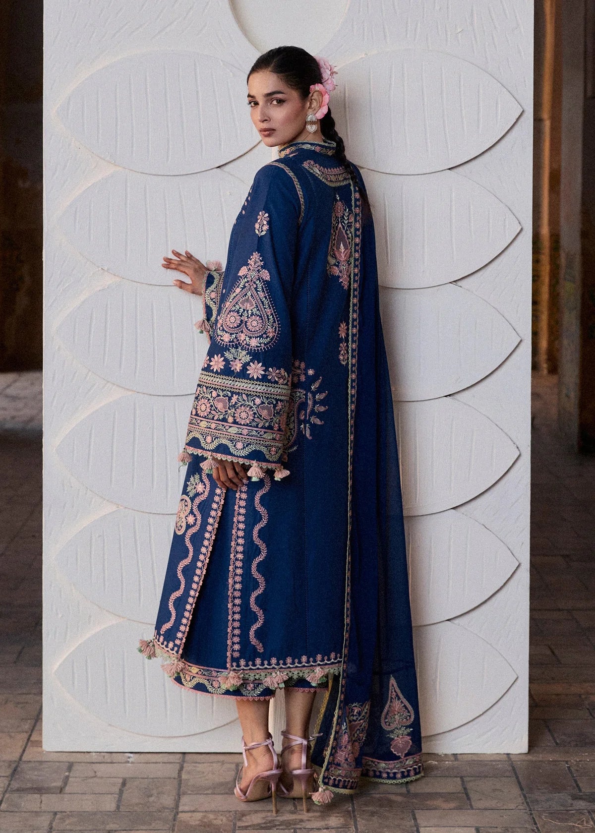 Rear model view showcasing the structural embroidered back panels and the long elegant drape of the matching blue chiffon dupatta.