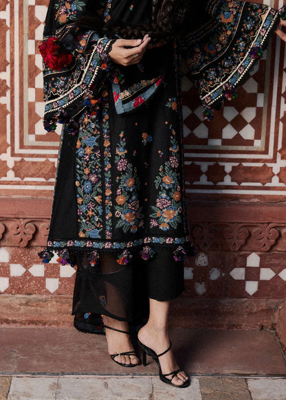 Focus view of the embroidered daman border patterns and panel finishing details on the black lawn shirt material.