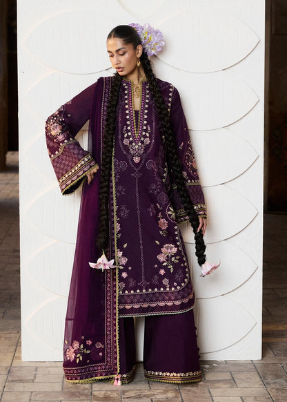 Close-up front portrait focusing on the rich light green and pink neckline threadwork embroidery and broad decorative panel bands across the sleeves.