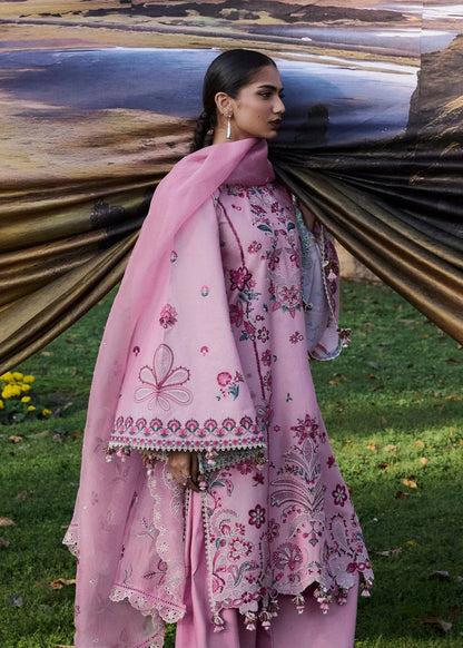 Close-up front portrait focusing on the rich floral appliqué neckline embroidery details, green leaf accents, and sheer sleeve patches.