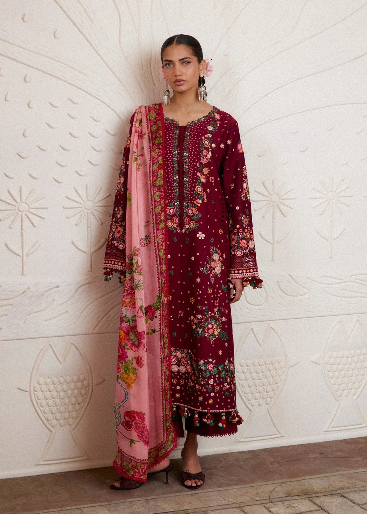 Full-length presentation of the rich maroon embroidered lawn shirt and matching trousers on model.