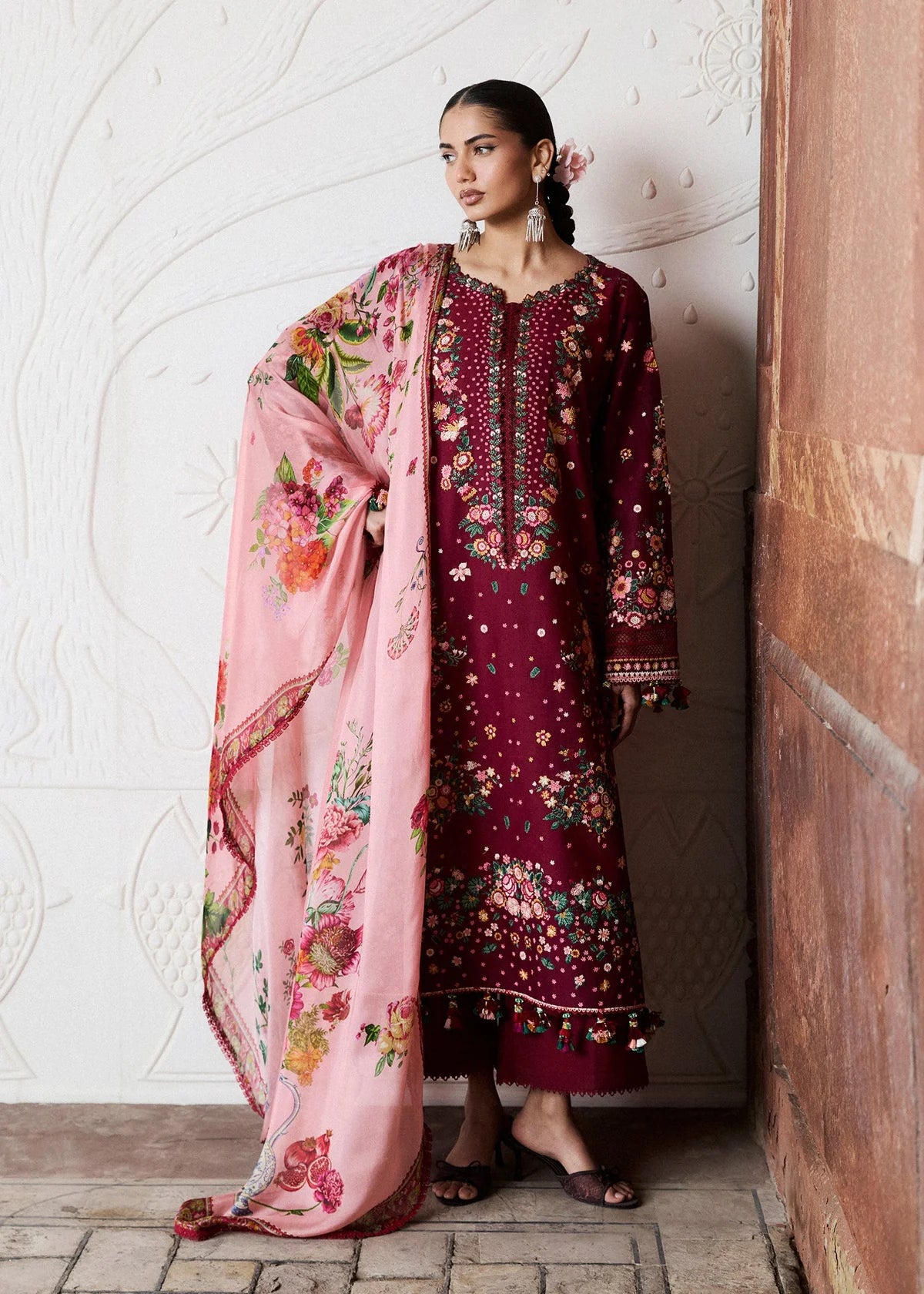 Profile view showcasing the smooth fall of the contrast pastel pink digital printed silk dupatta with floral layouts.