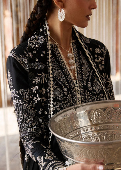 Rear model view showcasing the extensive white geometric embroidery layouts across the black back shirt panels and trailing dupatta drape.