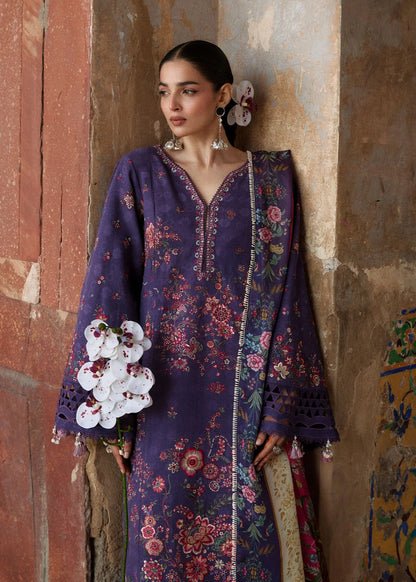 Close-up portrait focusing on the vibrant red and pink asymmetric floral neckline embroidery patterns and expansive sleeves.