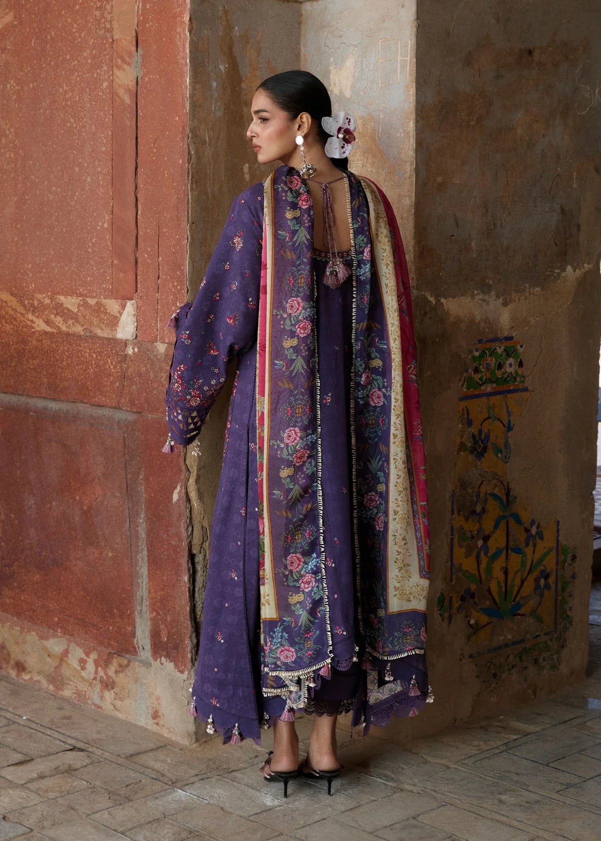 Rear profile view displaying the continuous printed silk dupatta fall and jacquard layout design of the purple shirt back panel.