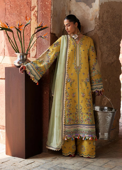 Full profile model view showcasing the combination of the yellow lawn shirt and wide embroidered mint green chiffon dupatta drape.