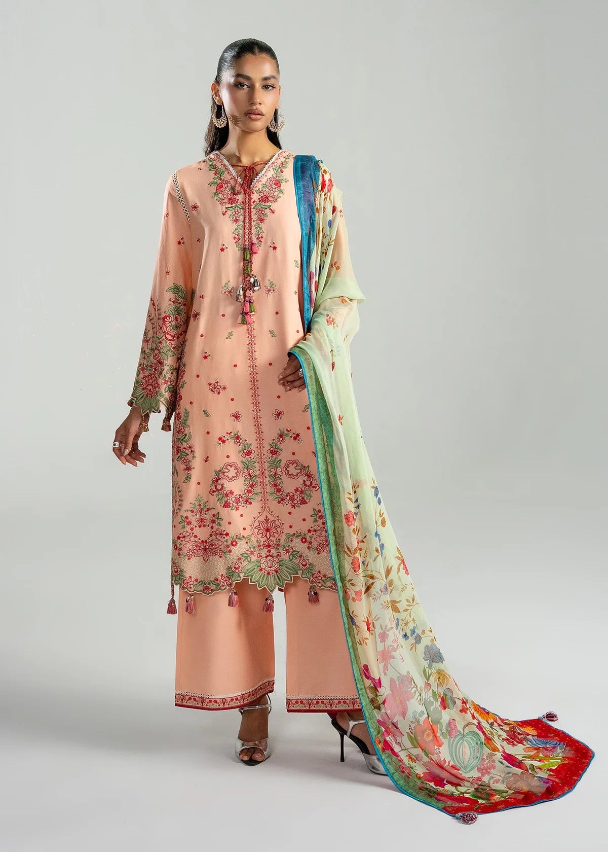 Full-length walk presentation showing the complete look of the premium embroidered peach dress pack in studio lighting.